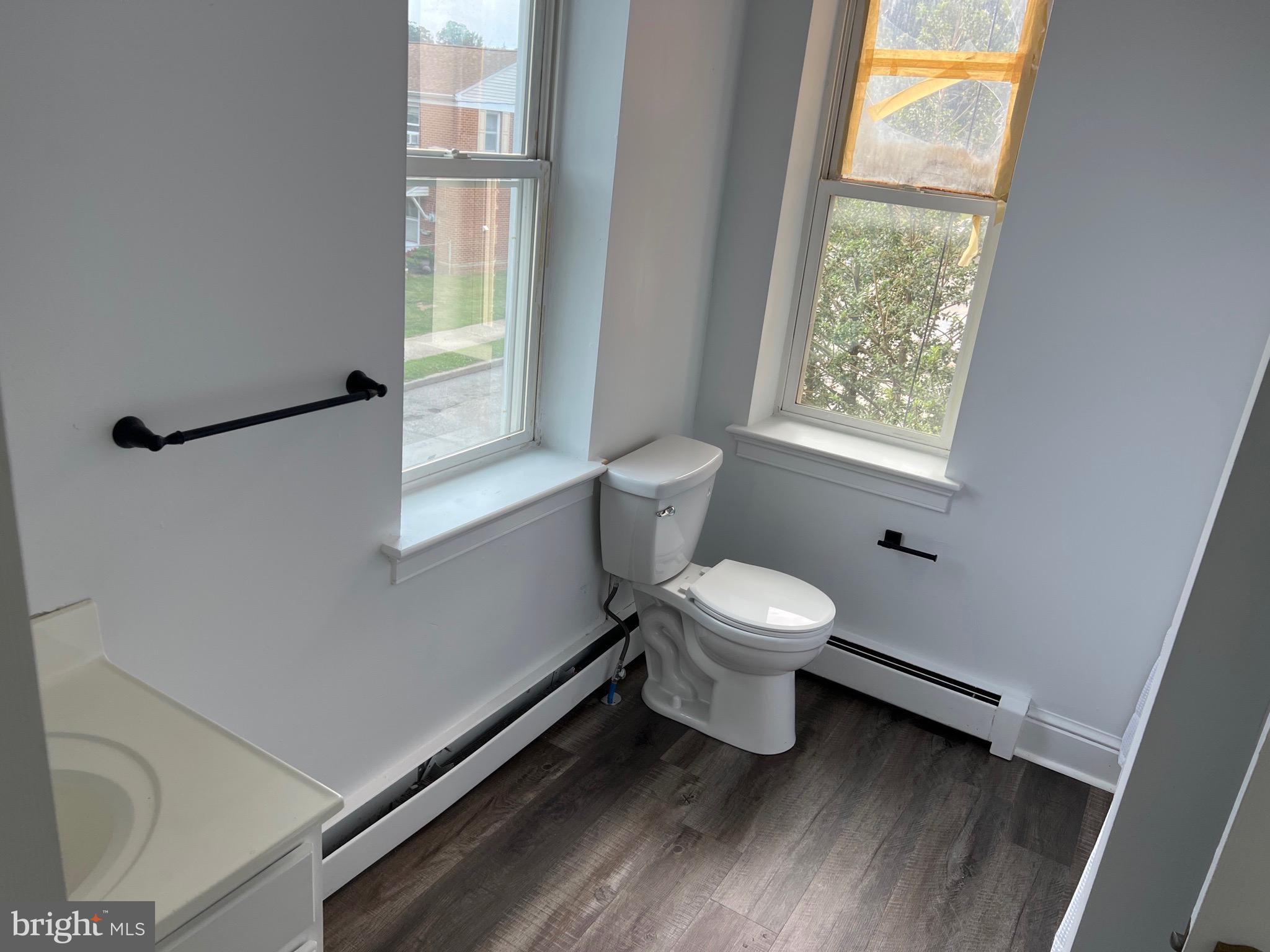 533 Thomas Street York, PA 17404 - Photo 17 of 26 a bathroom with a toilet sink a window and shower