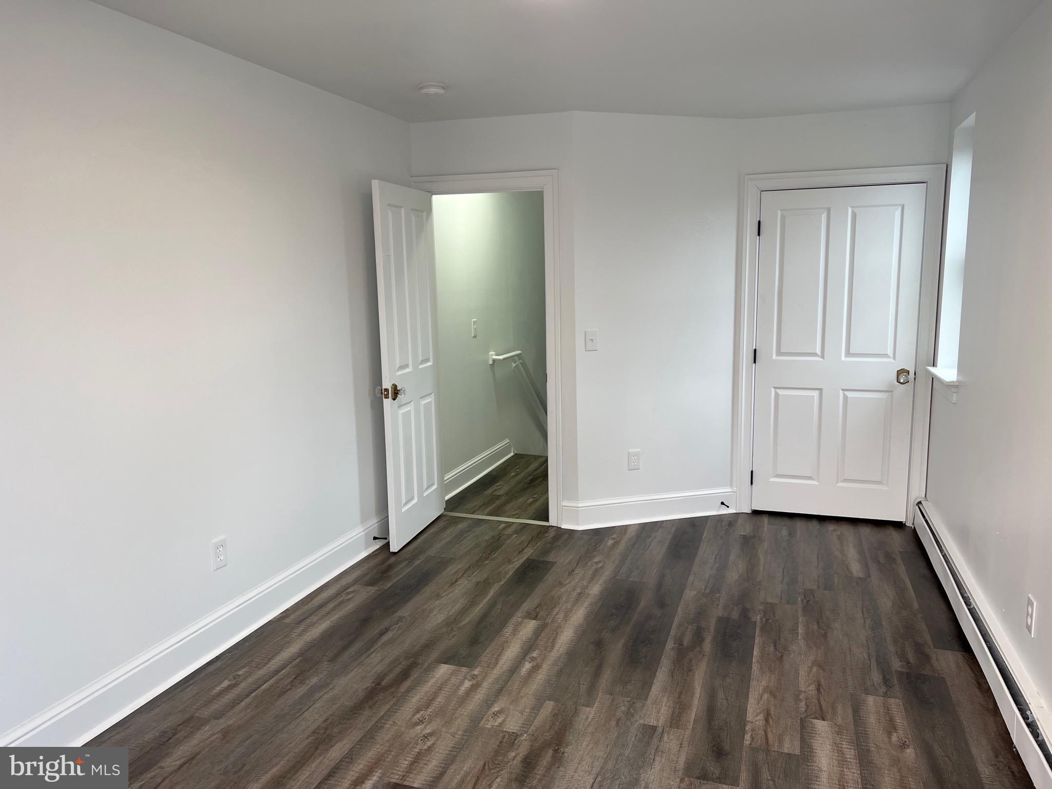533 Thomas Street York, PA 17404 - Photo 19 of 26 a view of an empty room with wooden floor and a window