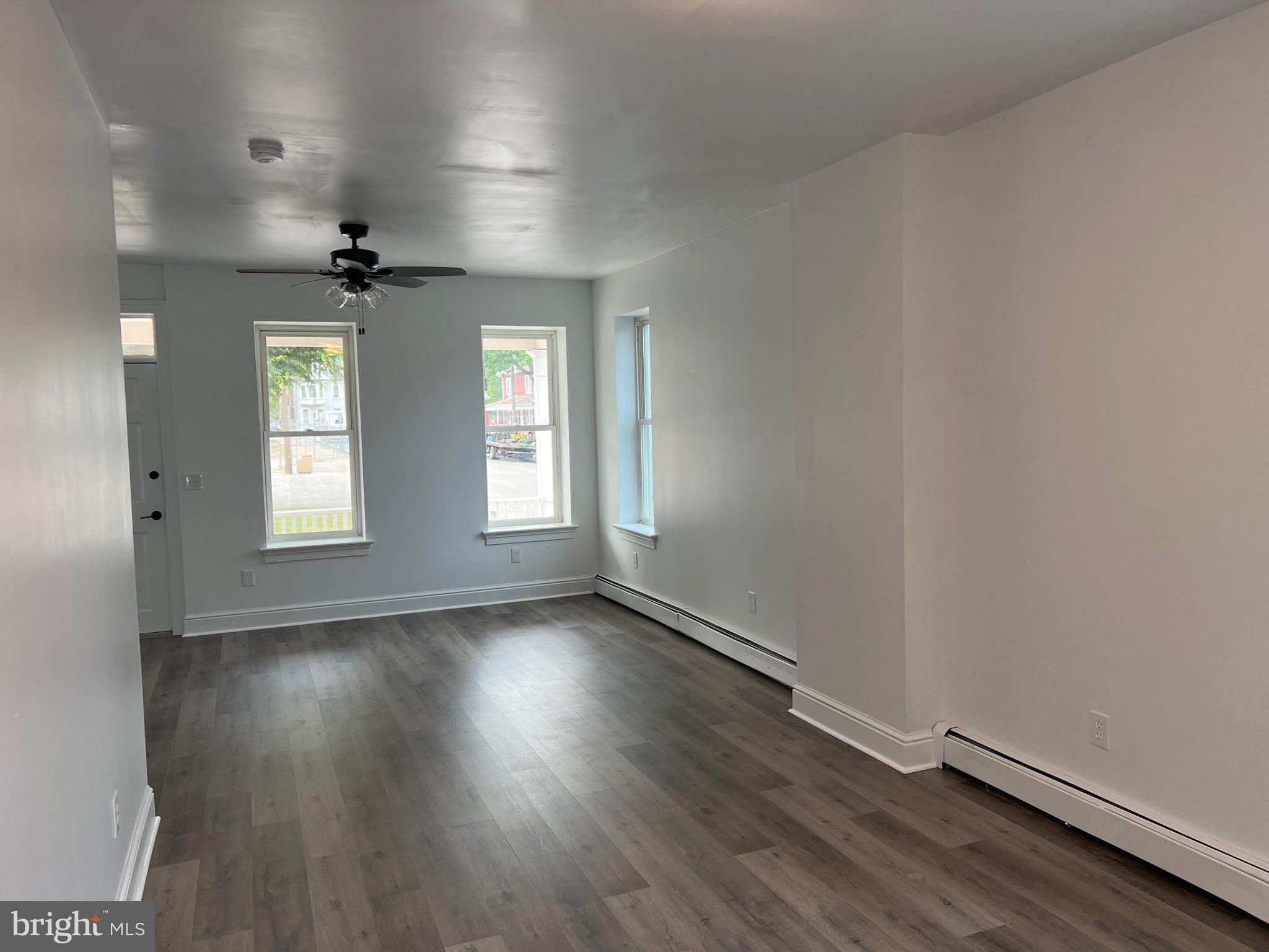 533 Thomas Street York, PA 17404 - Photo 6 of 26 an empty room with wooden floor and windows