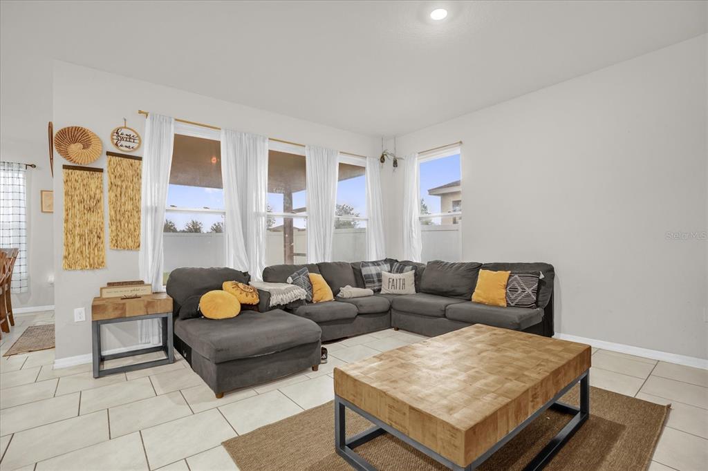 6775 Sarus Crane Point Harmony, FL 34773 - Photo 2 of 28 a living room with furniture and next to a window