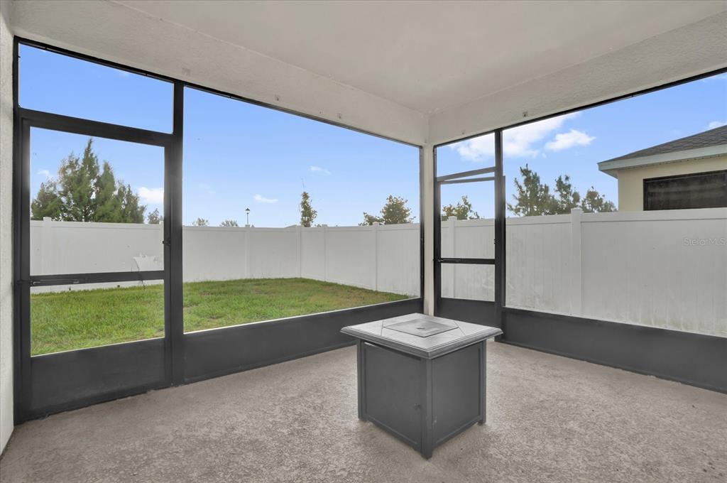 6775 Sarus Crane Point Harmony, FL 34773 - Photo 23 of 28 a view of living room with a large window and yard