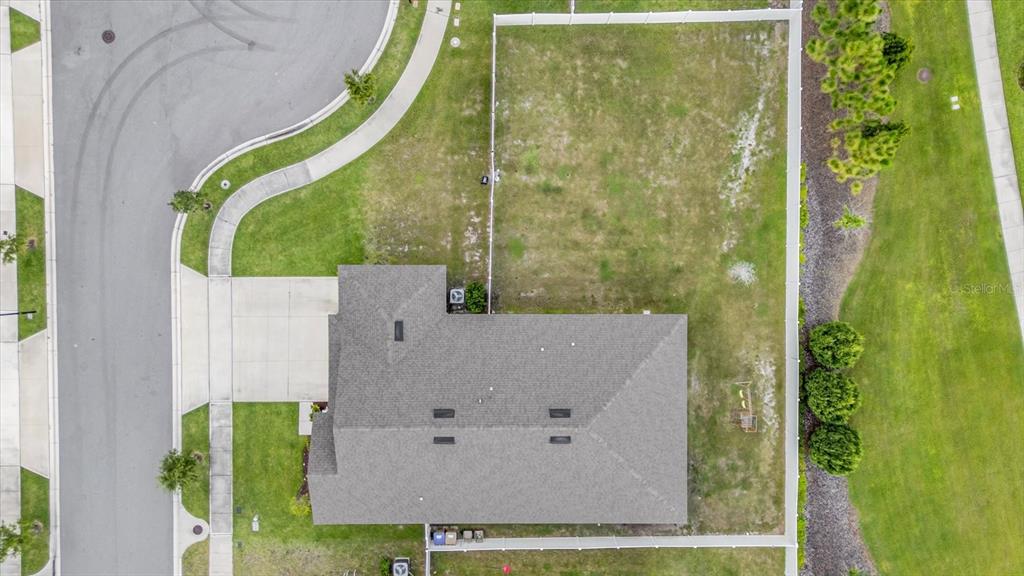 6775 Sarus Crane Point Harmony, FL 34773 - Photo 26 of 28 a bathroom with a tub and a shower