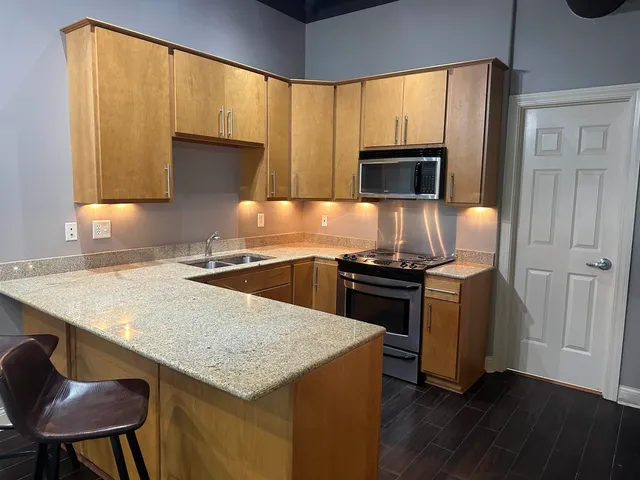 a kitchen with a stove and a microwave
