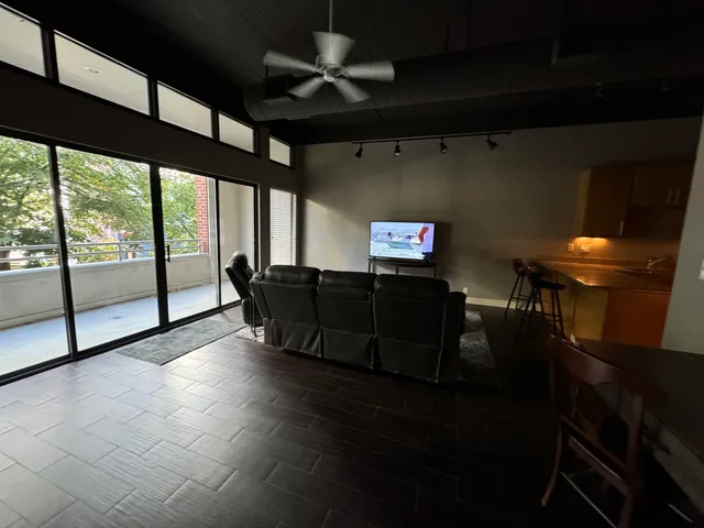 a view of an empty room with a windows