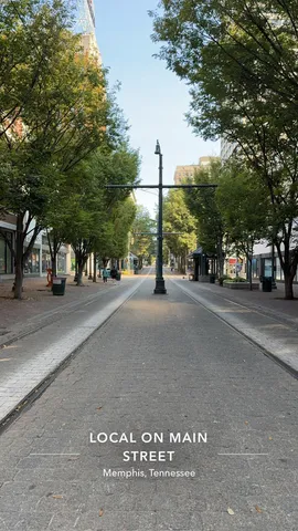 a view of street with a cars parked on road