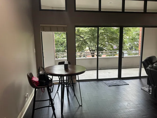 a view of a dining room with furniture and window