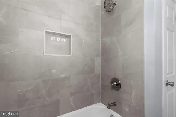 a bathroom with a shower and toilet
