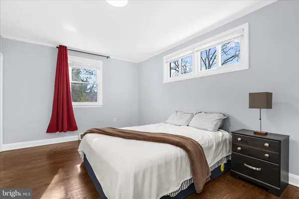a bedroom with a bed and a lamp