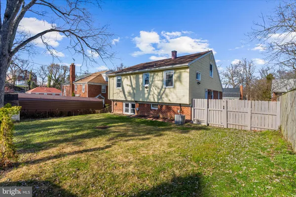 a view of a house with a yard porch and sitting area