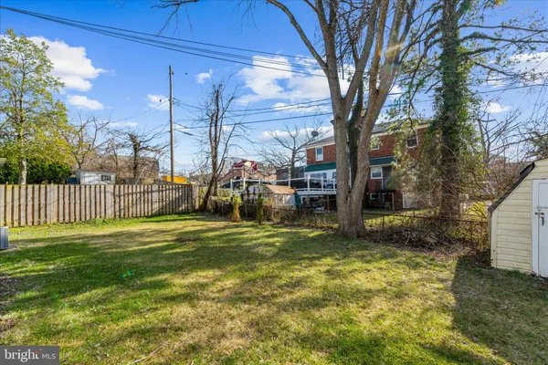 aerial view of a house with a yard