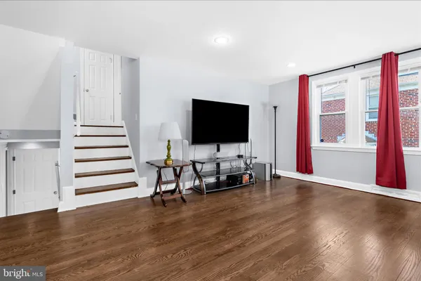 a view of a livingroom with furniture and a flat screen tv