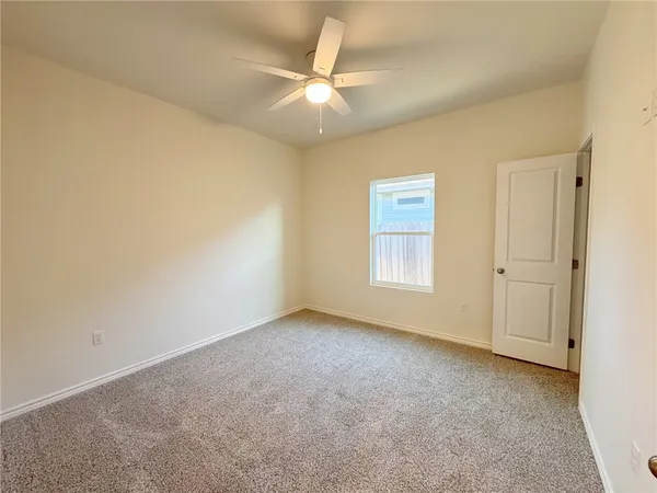 a bathroom with a toilet sink and shower