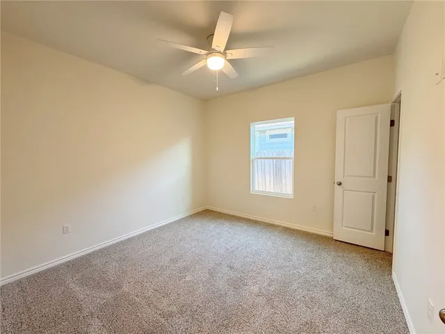 a bathroom with a toilet sink and shower