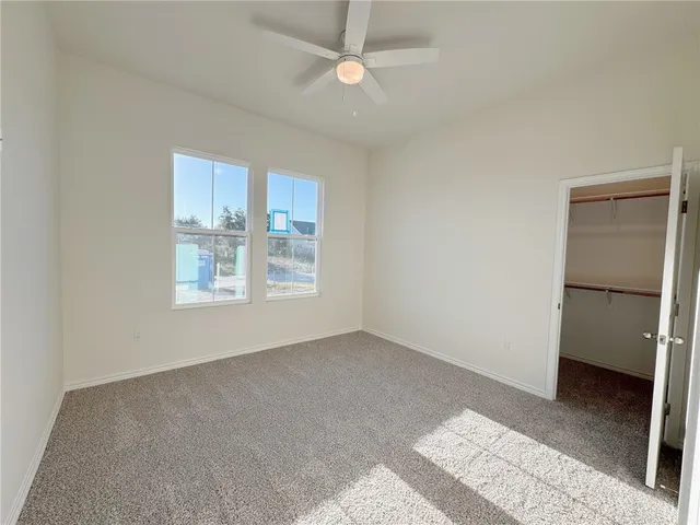 a view of an empty walk in closet
