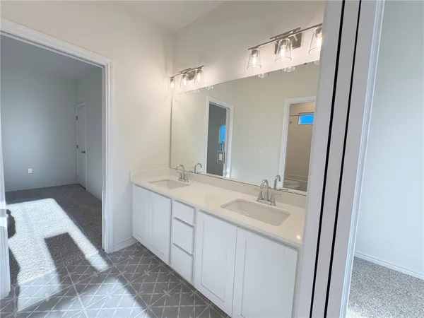 a bathroom with a toilet a sink and a shower