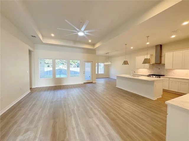 a view of kitchen with wooden floor and windows