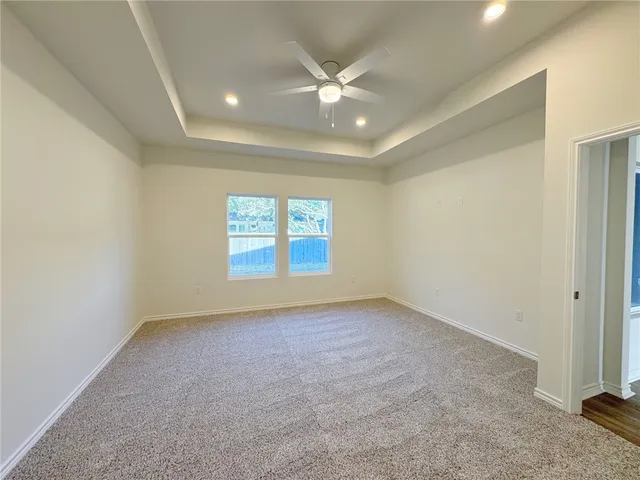 a spacious bathroom with a double vanity sink mirror and bathtub