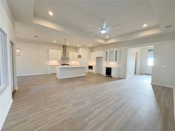 a view of kitchen and kitchen with furniture wooden floor and window