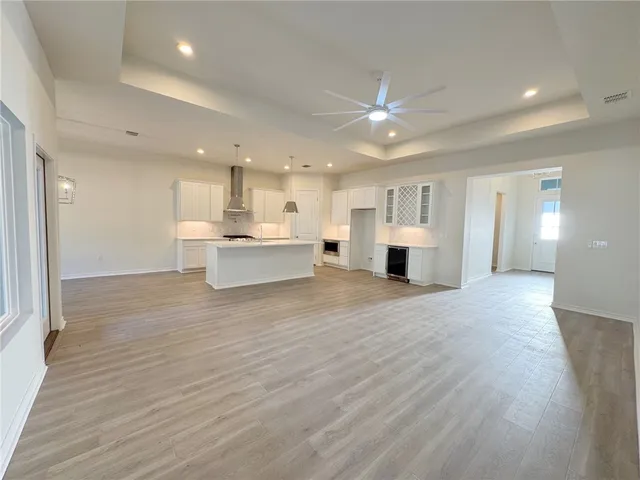 a view of kitchen and kitchen with furniture wooden floor and window