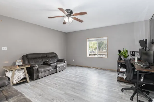 a bed room with furniture and a window