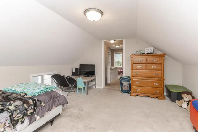 a bedroom with a bed and furniture