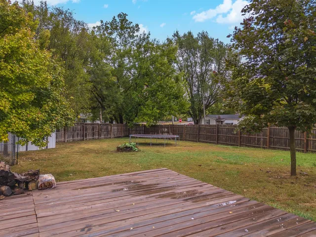 a view of a house with swimming pool and sitting area