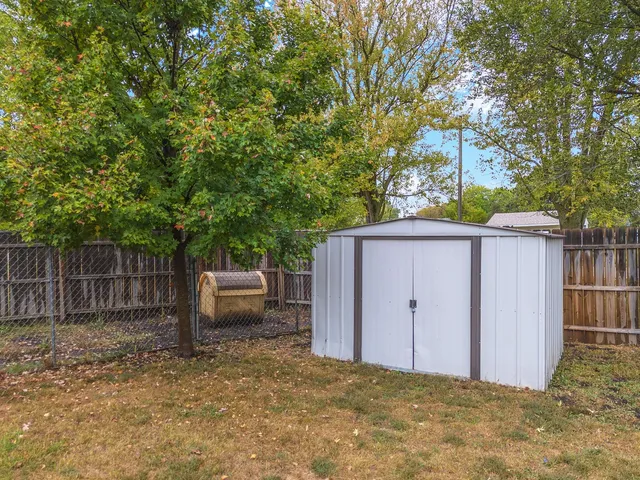 a view of a house with pool and chairs
