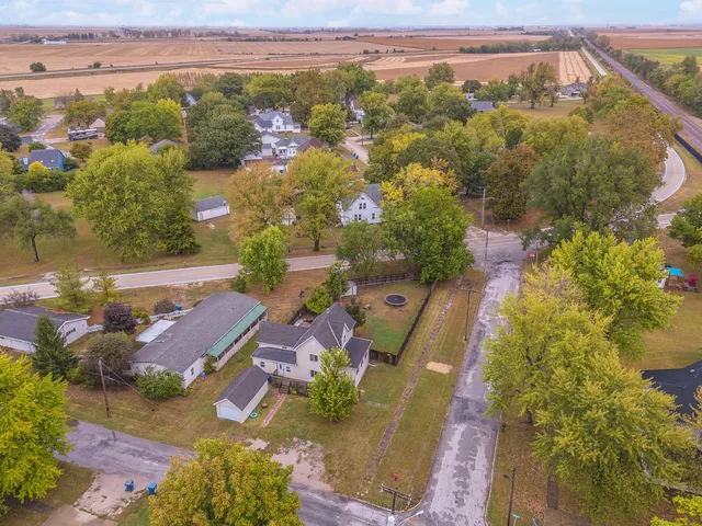 an aerial view of residential houses with outdoor space