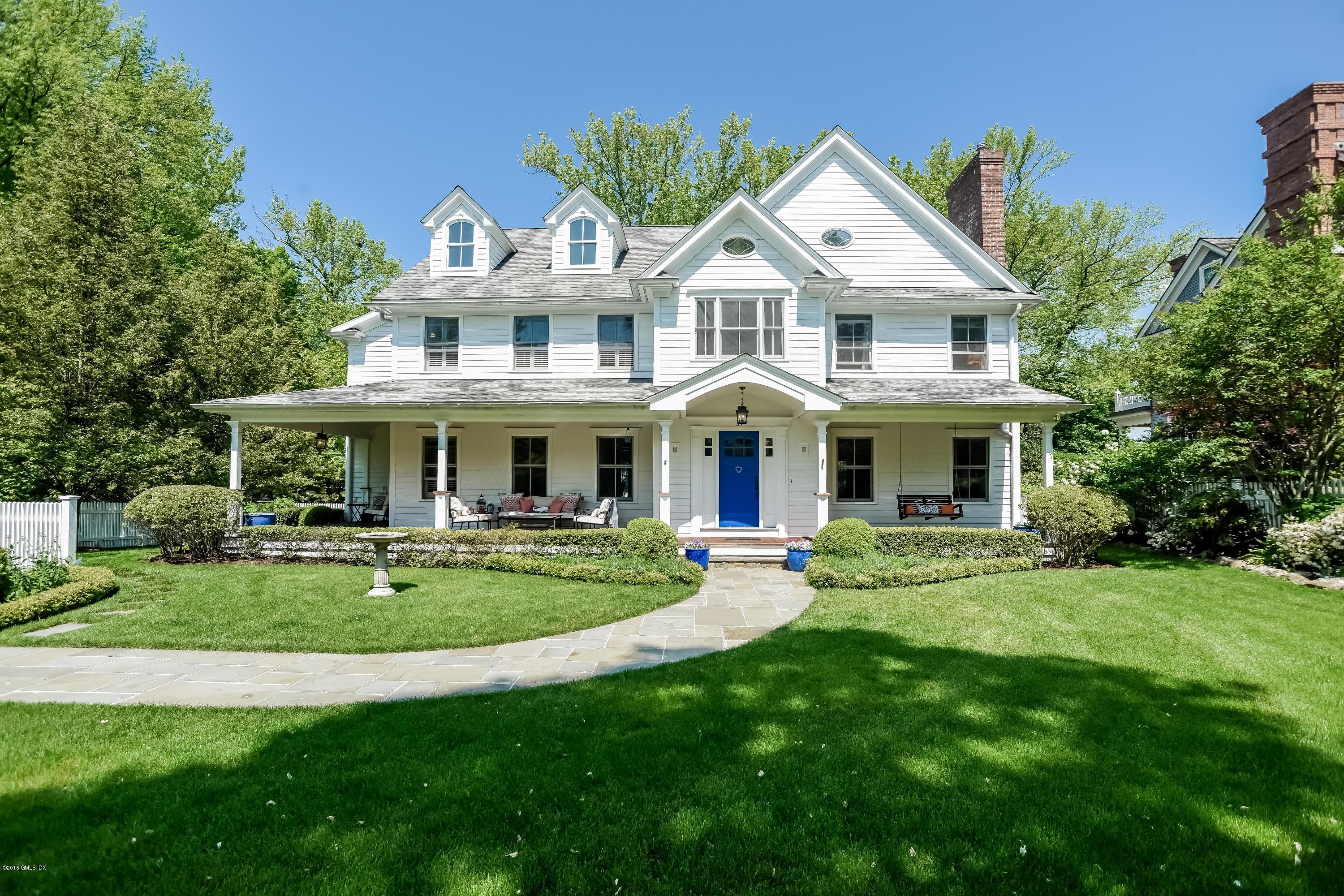 35 Lockwood Road Riverside, CT 06878 - Photo 1 of 39 a front view of a house with a garden and porch