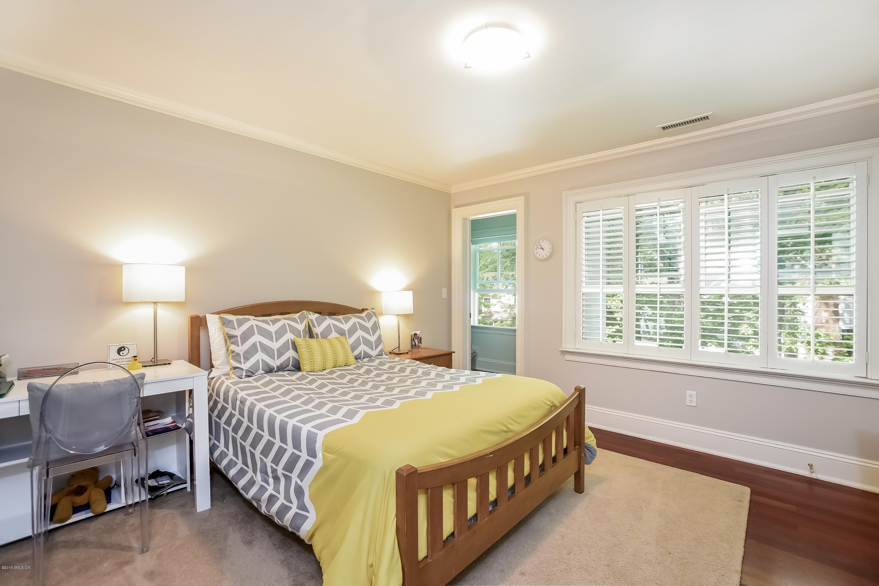 35 Lockwood Road Riverside, CT 06878 - Photo 23 of 39 a bedroom with a bed and a window