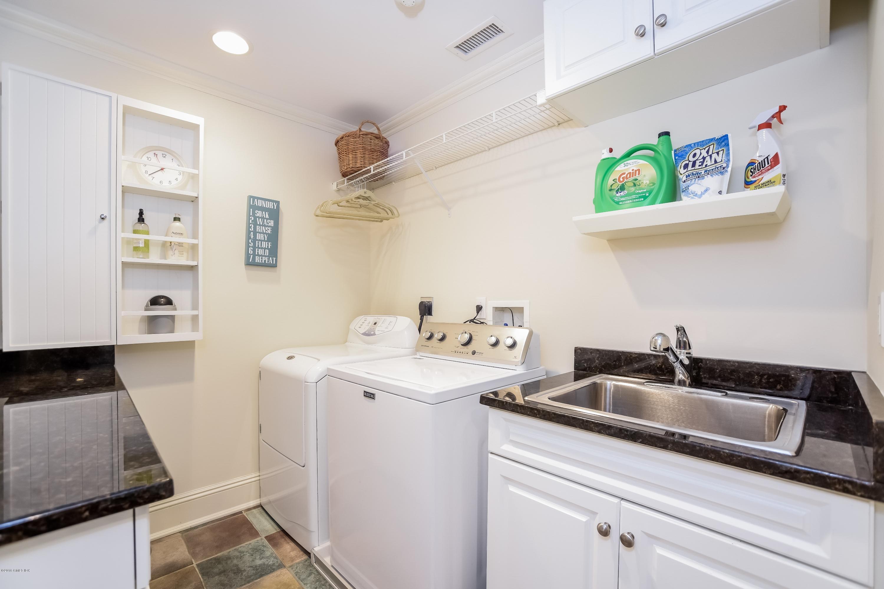 35 Lockwood Road Riverside, CT 06878 - Photo 26 of 39 a kitchen that has a sink and a stove