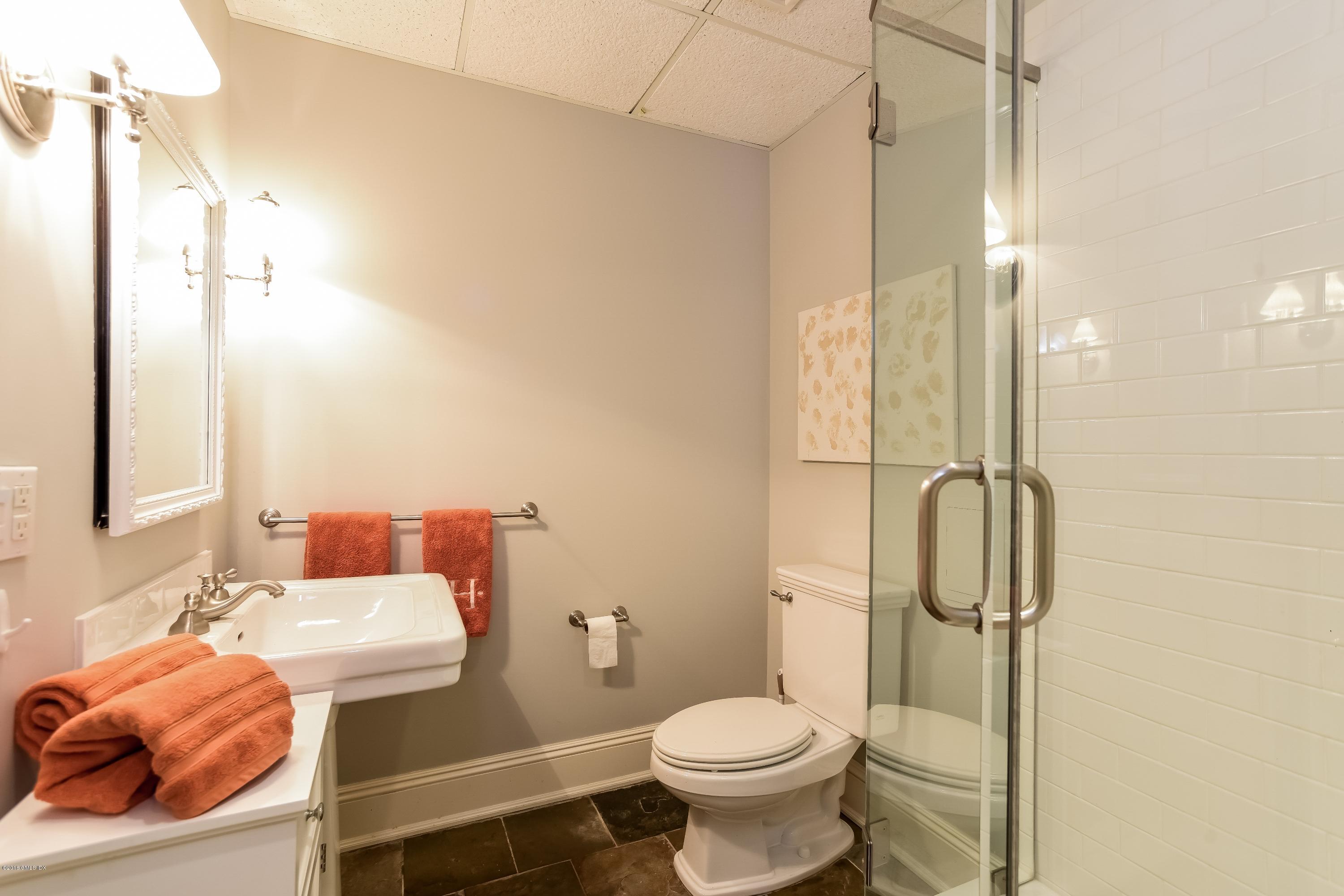 35 Lockwood Road Riverside, CT 06878 - Photo 33 of 39 a bathroom with a sink toilet and shower