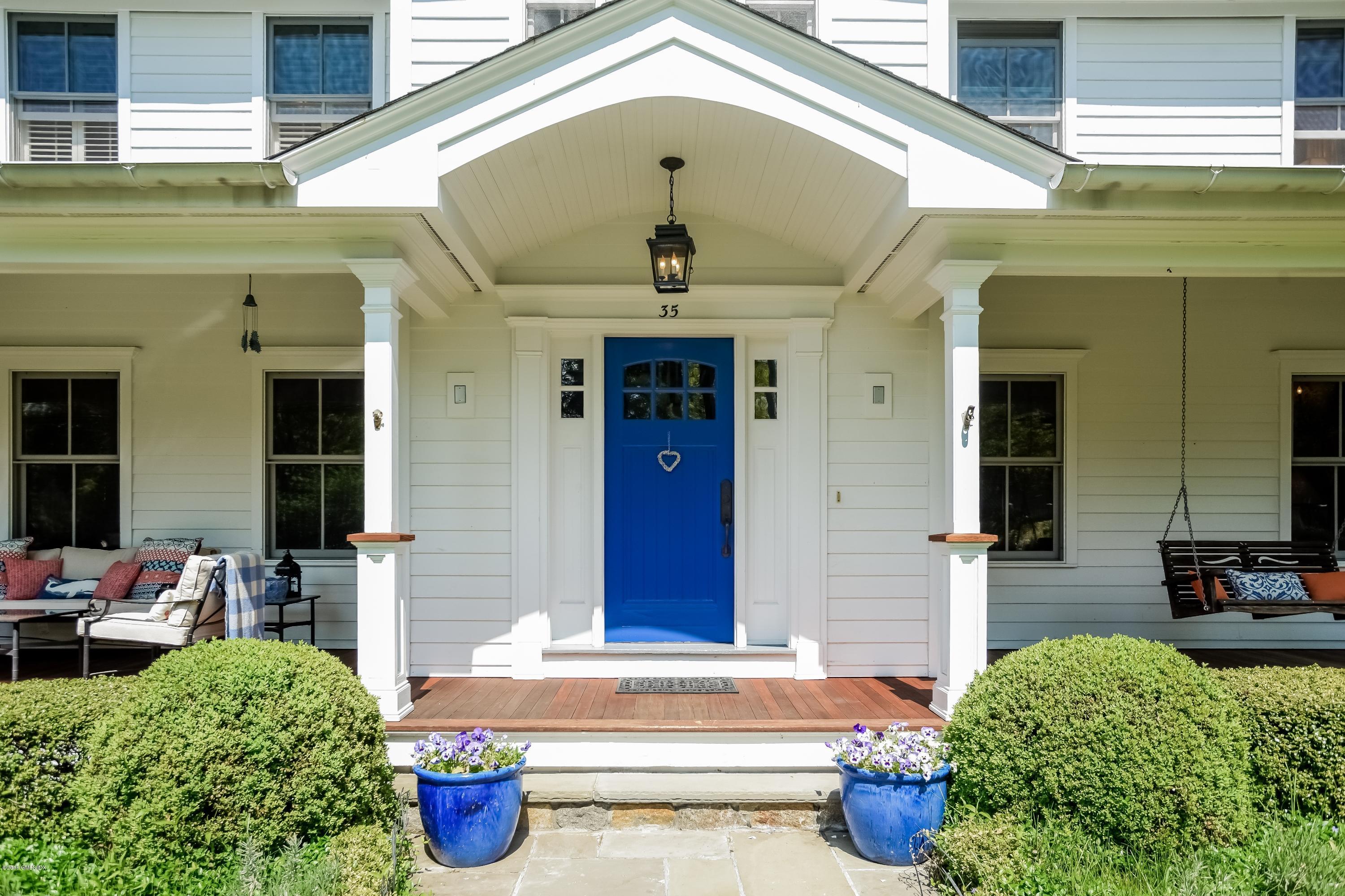 35 Lockwood Road Riverside, CT 06878 - Photo 5 of 39 a front view of a house with entryway