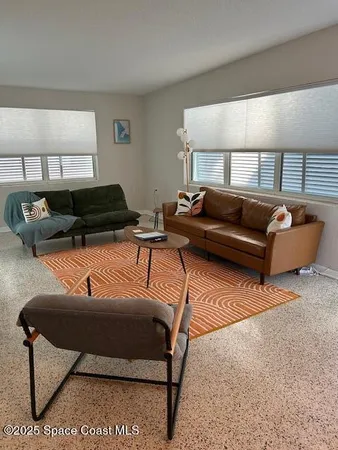 a living room with furniture and a couch