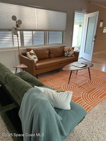 a living room with furniture and a couch