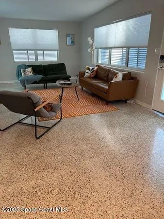 a living room with furniture and a couch