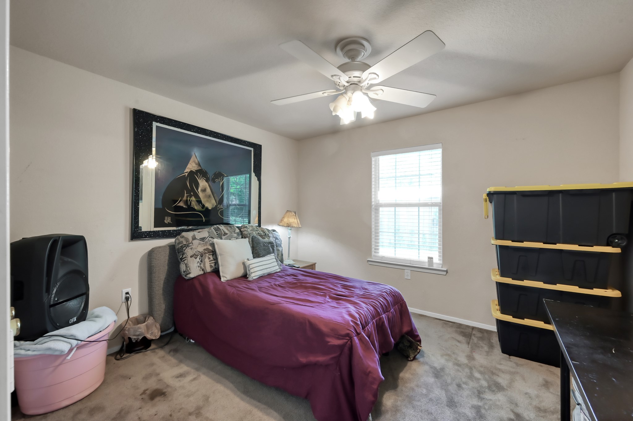 805 Webb Street Conroe, TX 77301 - Photo 15 of 19 a bedroom with a bed and a television