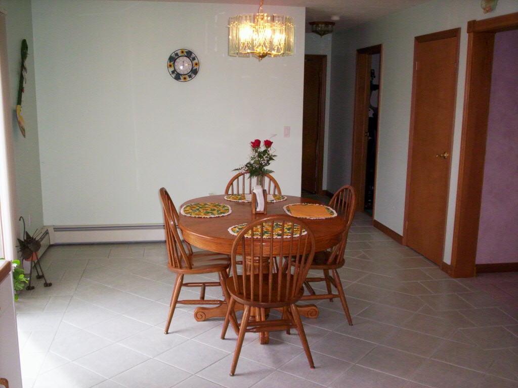 Weir Mt Road Gilbert, PA 18331 - Photo 8 of 14 a dining room with furniture and chandelier potted plants
