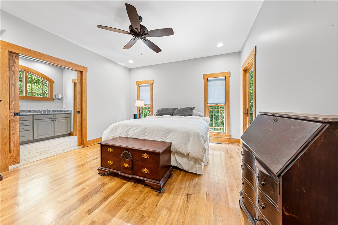 285 Bertha Allen Road Westminster, SC 29693 - Photo 9 of 50 Hardwood floors and bright windows illuminate this spacious bedroom with an adjoining primary bath.