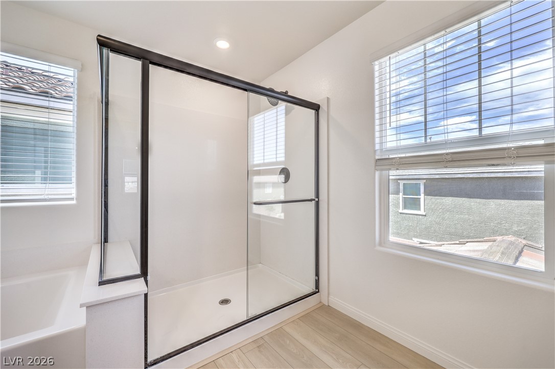 3782 Alla Rocca Avenue Henderson, NV 89044 - Photo 25 of 55 This bright bathroom features a spacious shower and ample natural light from large windows.