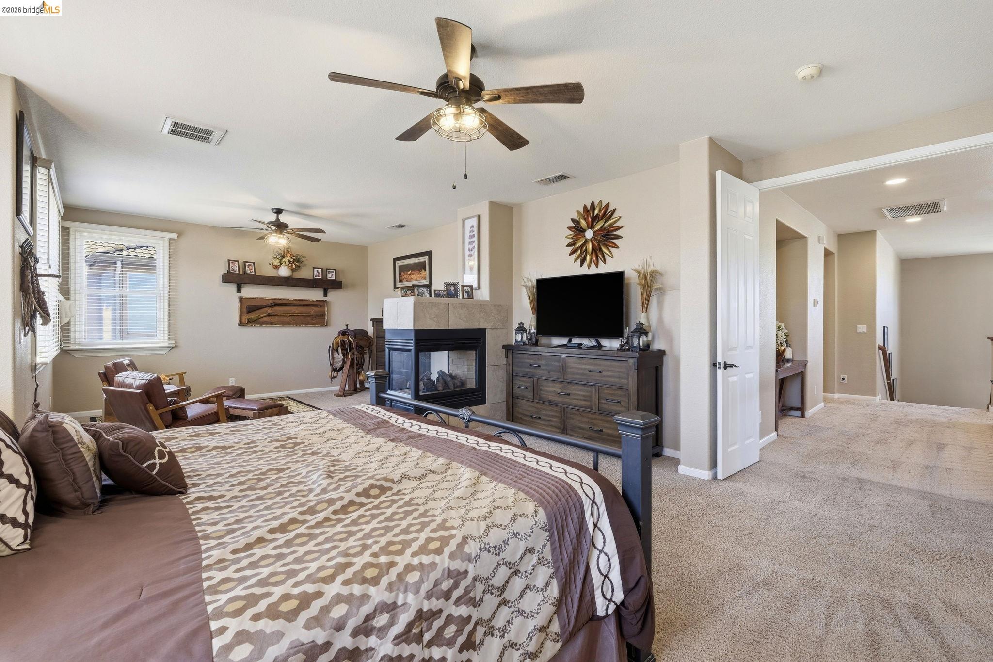 3438 Keystone Loop Discovery Bay, CA 94505 - Photo 22 of 57 a bedroom with a bed flat screen tv and a couch