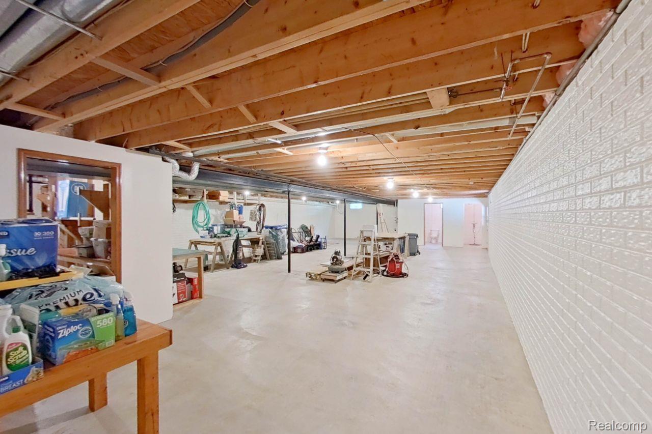 10201 Washburn Road Goodrich, MI 48438 - Photo 58 of 85 Spacious unfinished basement featuring exposed wood joists and concrete flooring