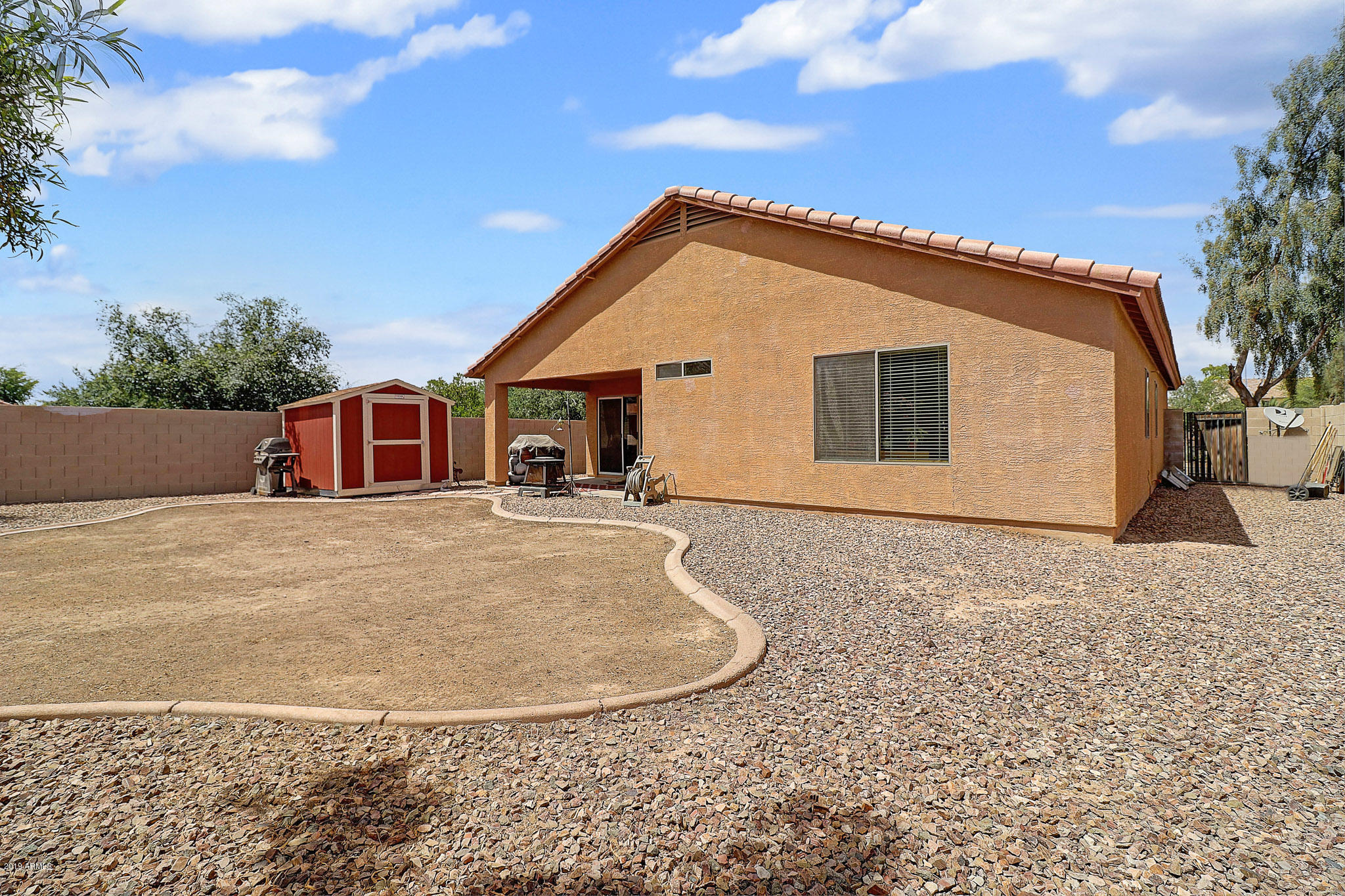 9947 West Riverside Avenue Tolleson, AZ 85353 - Photo 23 of 25 a view of a house with a backyard