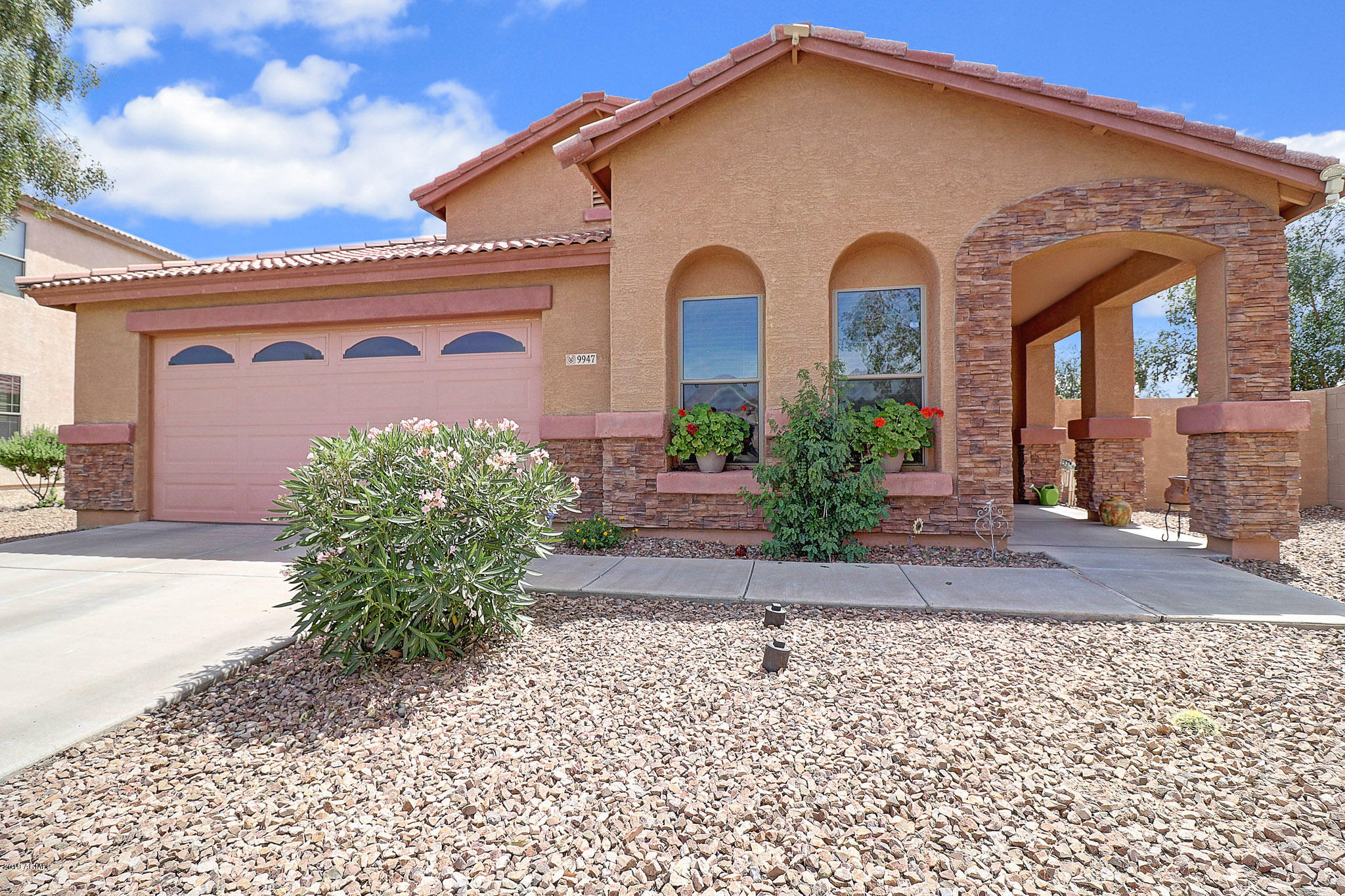 9947 West Riverside Avenue Tolleson, AZ 85353 - Photo 4 of 25 a front view of a house