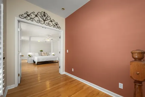 a view of a room that has a bed and a window in it