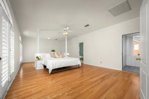 a large white bed in a white room