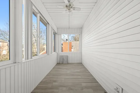 a view of a hallway with a window