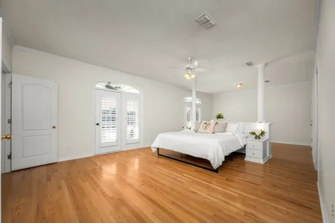 a large white bed in a white room