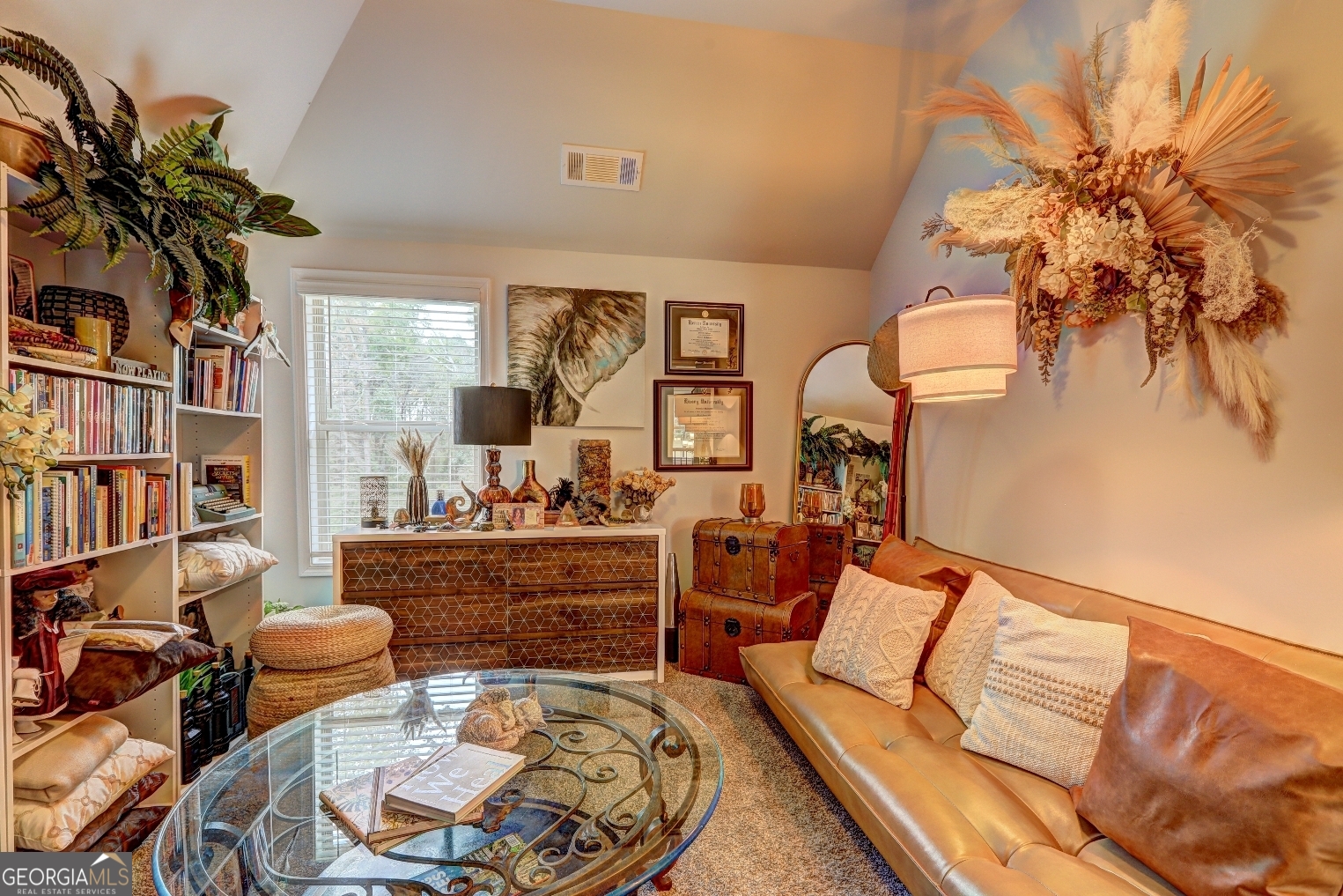 269 Baumgard Way Locust Grove, GA 30248 - Photo 11 of 23 a living room with furniture and a potted plant