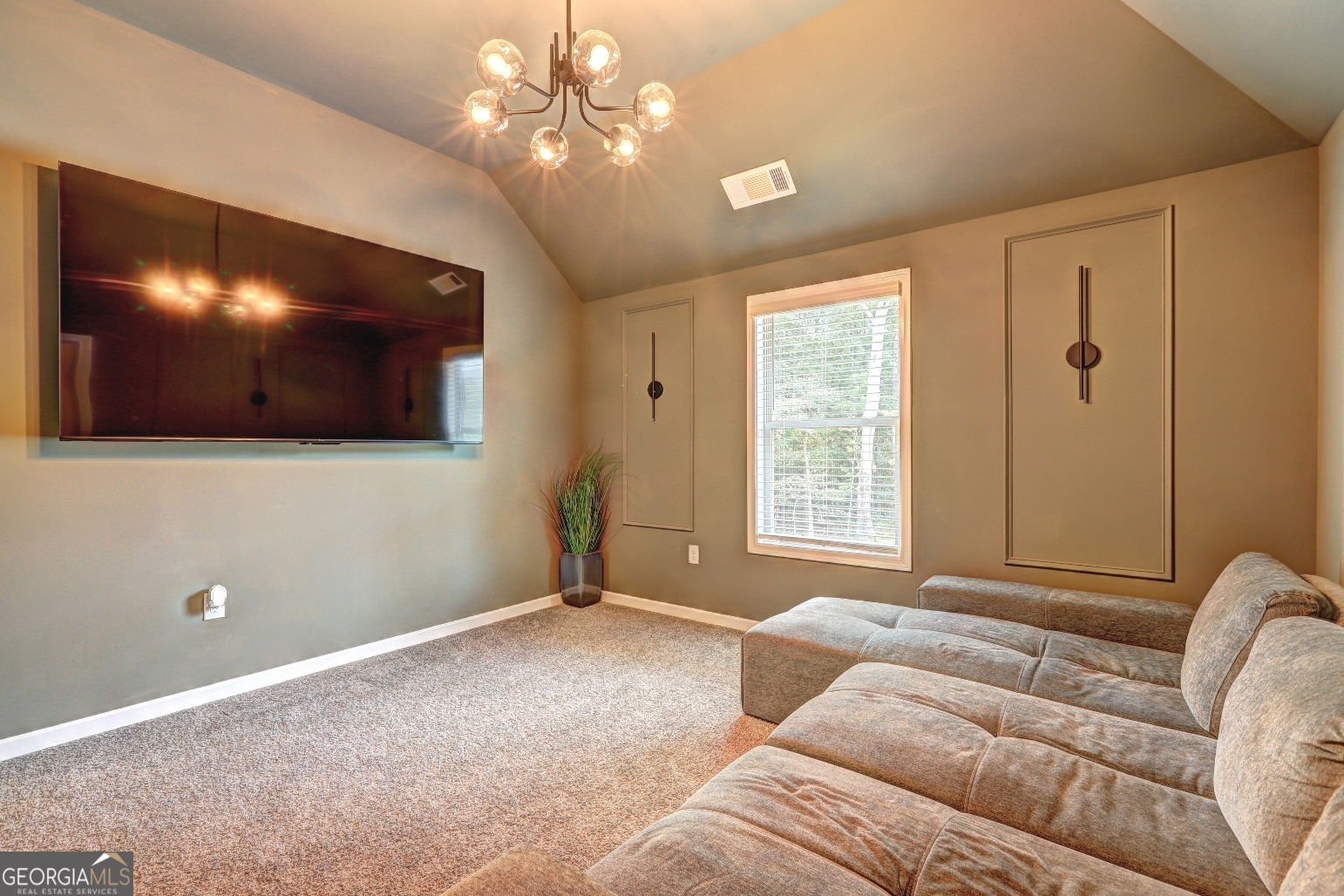 269 Baumgard Way Locust Grove, GA 30248 - Photo 14 of 23 a living room with furniture and a flat screen tv